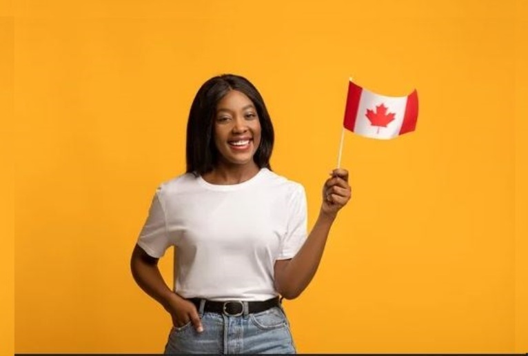 Girl holding a Canadian flag